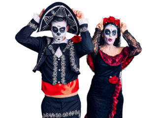 Young couple wearing mexican day of the dead costume over background doing funny gesture with finger over head as bull horns