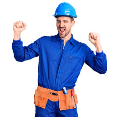 Young handsome man wearing worker uniform and hardhat dancing happy and cheerful, smiling moving casual and confident listening to music