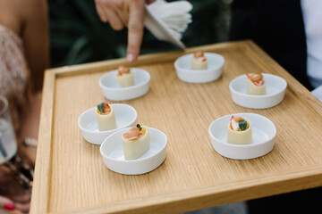 Rich bright Italian aperitif at a luxury beautiful wedding in a luxurious villa in Italy, Tuscany. Typical Italian appetizers, cheeses, ham, tomatoes and berries on the table