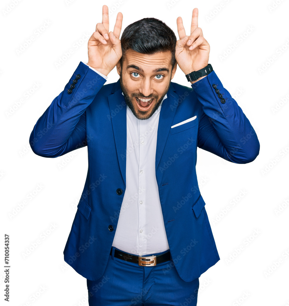 Poster young hispanic man wearing business jacket posing funny and crazy with fingers on head as bunny ears