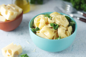 A bowl with Italian dumplings - tortellini	