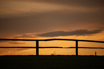 Fototapeta premium sunset in the village village life setting sun before