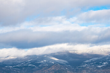 Fresh snow on the tops of small mountains
