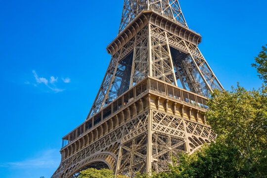 First and second level of the Eiffel Tower on a sunny summer day with blue sky in Paris, France