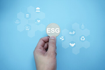 ESG (environmental, social and governance) concept, Business sustainable and ethical Network connection, Magnifier focus to green Earth with ESG icon for develop green energy concept.