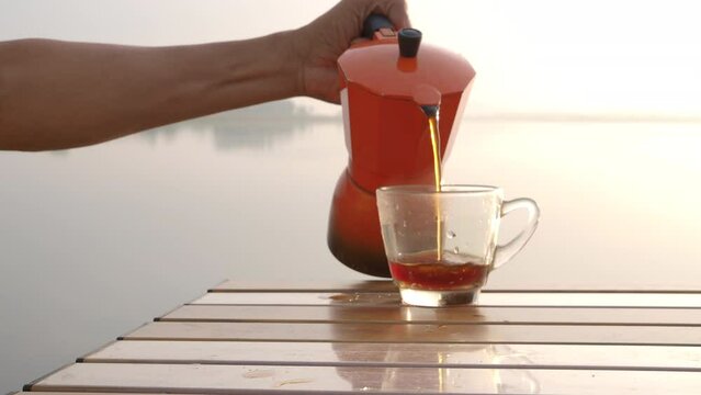 Brew your morning coffee in a moka pot by the river.