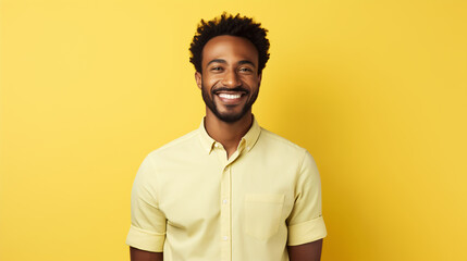 A young man with a radiant smile and casual shirt emanates warmth and confidence, making it a perfect shot for representing friendly customer service or approachable leadership.