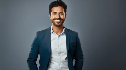 Foto op Plexiglas Charismatic businessman in casual blazer and crisp white shirt radiates warmth and confidence against a grey background, perfectly suited for casual corporate or entrepreneurial representations © SkyLine