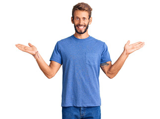 Fototapeta premium Handsome blond man with beard wearing casual clothes celebrating victory with happy smile and winner expression with raised hands