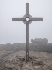 Cross at Topferbaude viewpoint restaurant and hut next to hill Topfer