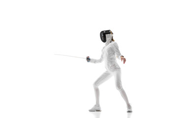 Obraz premium Sports training. An athlete demonstrating the skill and form developed through dedicated sports training. Female fencer in motion over white background. Concept of sport, competition, championship