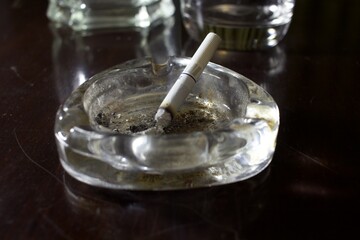 Fototapeta na wymiar ashtray and cigarettes on a table, no smoking day, tobacco free day