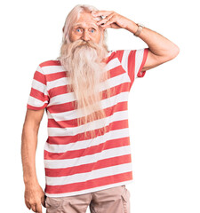 Old senior man with grey hair and long beard wearing striped tshirt worried and stressed about a problem with hand on forehead, nervous and anxious for crisis