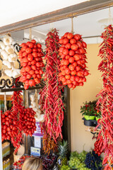 Dried Calabrian chili peppers hanging on street market