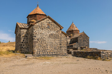 View of the Sevanavank, monastic complex located on the shore Lake Sevan. Armenia. - 710095142