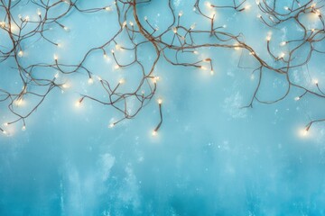 Soft Christmas lights from a garland with Christmas tree branches on a peach background