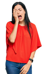 Beautiful young woman wearing casual clothes yawning tired covering half face, eye and mouth with hand. face hurts in pain.