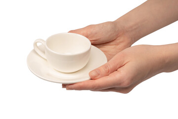 Female hand holding coffee cup and saucer isolated on white background.