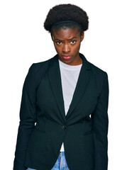 Young african american girl wearing business clothes skeptic and nervous, frowning upset because of problem. negative person.