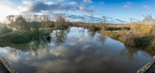 Fototapeta premium Alencon, France - 12 13 2023: View of the Sarthe river during floods.