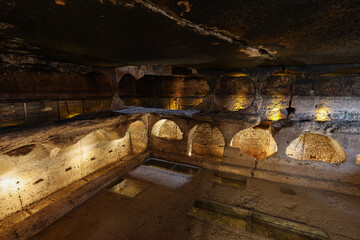 Dara ruins is an ancient city consisting of many interconnected caves in rocks. Dara Ancient City. Mesopotamia. Mardin, Turkey. The Gallery of Dara Ancient City, a huge rock-cut tomb.