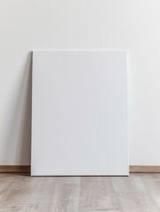 blank art canvas mockup on the laminate floor against the white wall - obrazy, fototapety, plakaty