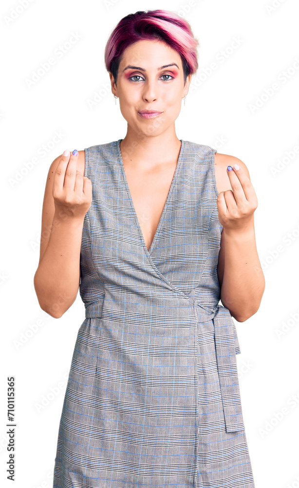 Sticker Young beautiful woman with pink hair wearing casual clothes doing money gesture with hands, asking for salary payment, millionaire business