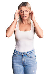 Young beautiful blonde woman wearing casual sleeveless t-shirt with hand on head for pain in head because stress. suffering migraine.