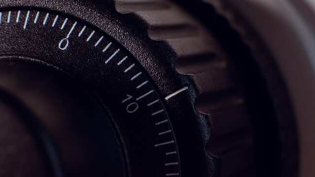 Watchmaking. Swiss watchmaker adjusts the most precise equipment to minimize the time error. Exclusive watchmaking. A close-up of the micrometer scale