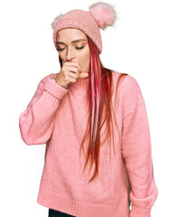 Young caucasian woman wearing casual clothes and wool cap feeling unwell and coughing as symptom for cold or bronchitis. health care concept.