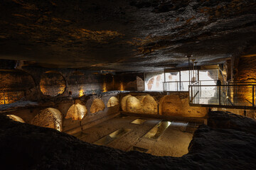 Dara ruins is an ancient city consisting of many interconnected caves in rocks. Dara Ancient City. Mesopotamia. Mardin, Turkey. The Gallery of Dara Ancient City, a huge rock-cut tomb.