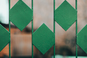 green pattern of an old fence from the communist times  - obrazy, fototapety, plakaty