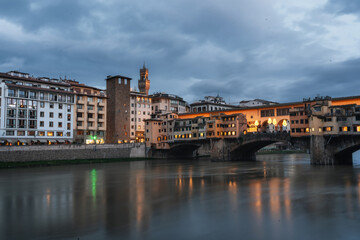 Fototapeta na wymiar Winter Florence. Bridges over the Arno River and Medieval Architecture.