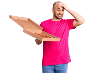 Young handsome man holding delivery pizza cardboard box stressed and frustrated with hand on head, surprised and angry face