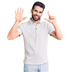 Young handsome man with beard wearing casual polo showing and pointing up with fingers number seven while smiling confident and happy.