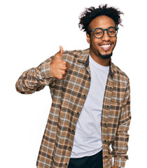Young african american man with beard wearing casual clothes and glasses doing happy thumbs up...