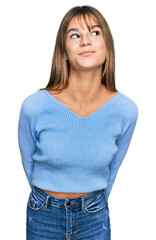 Obraz premium Teenager caucasian girl wearing casual clothes smiling looking to the side and staring away thinking.