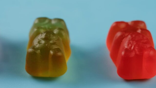 Jelly marmalade cola bottle bear close up, Confiture Bean candy jujube Marmalade bears with cod cannabis close up. 