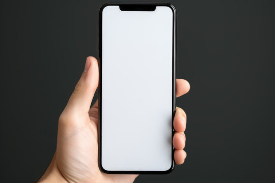 Person holding white phone in their hand. This image can be used to depict technology, communication, or mobile devices.