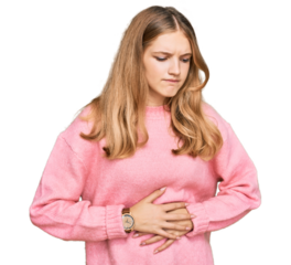 Beautiful young caucasian girl wearing casual winter sweater with hand on stomach because indigestion, painful illness feeling unwell. ache concept.