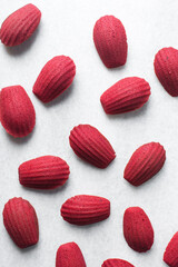 Red velvet madeleines on a marble tray, red madeleines cake or cookies for valentines - obrazy, fototapety, plakaty