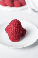 Top view of Red velvet madeleines on a white plate, red madeleines cake or cookies for valentines