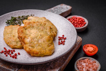 Delicious juicy fried chicken or pork pancakes with salt, spices and herbs