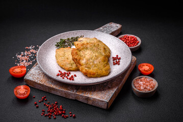 Delicious juicy fried chicken or pork pancakes with salt, spices and herbs