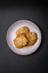 Delicious juicy fried chicken or pork pancakes with salt, spices and herbs