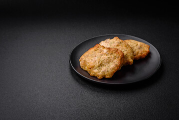 Delicious juicy fried chicken or pork pancakes with salt, spices and herbs
