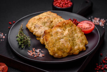 Delicious juicy fried chicken or pork pancakes with salt, spices and herbs