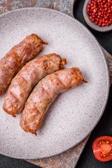 Delicious juicy grilled chicken or pork sausages with salt, spices and herbs