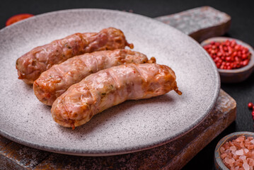 Delicious juicy grilled chicken or pork sausages with salt, spices and herbs