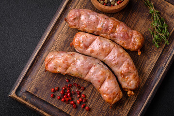 Delicious juicy grilled chicken or pork sausages with salt, spices and herbs